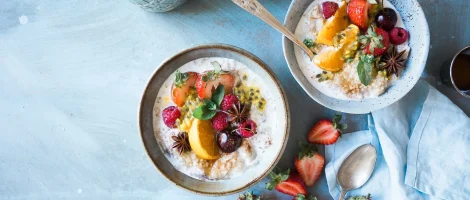 Healthy breakfast bowls with fruit and yogurt.